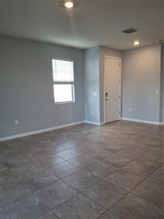 7891 Stonebrook Circle Wesley Chapel, FL 33545 - Photo 30 of 39 a view of an empty room with a window