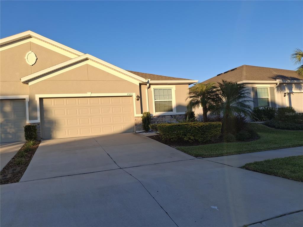 7891 Stonebrook Circle Wesley Chapel, FL 33545 - Photo 3 of 39 a view of a house with a yard