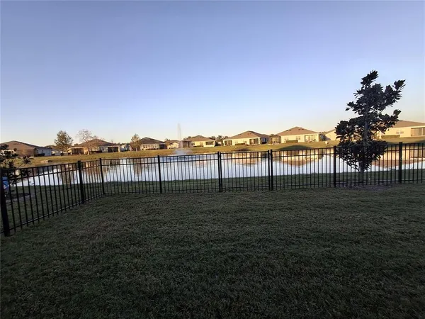 a view of an empty room with glass door