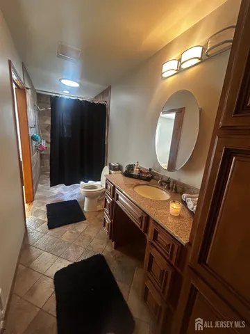 a bathroom with a double vanity sink and mirror