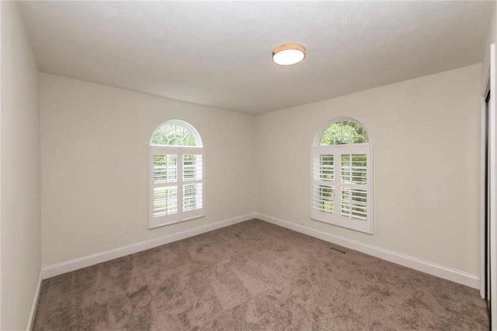 3819 Mason Creek Road Winston, GA 30187 - Photo 21 of 54 an empty room with windows and natural light