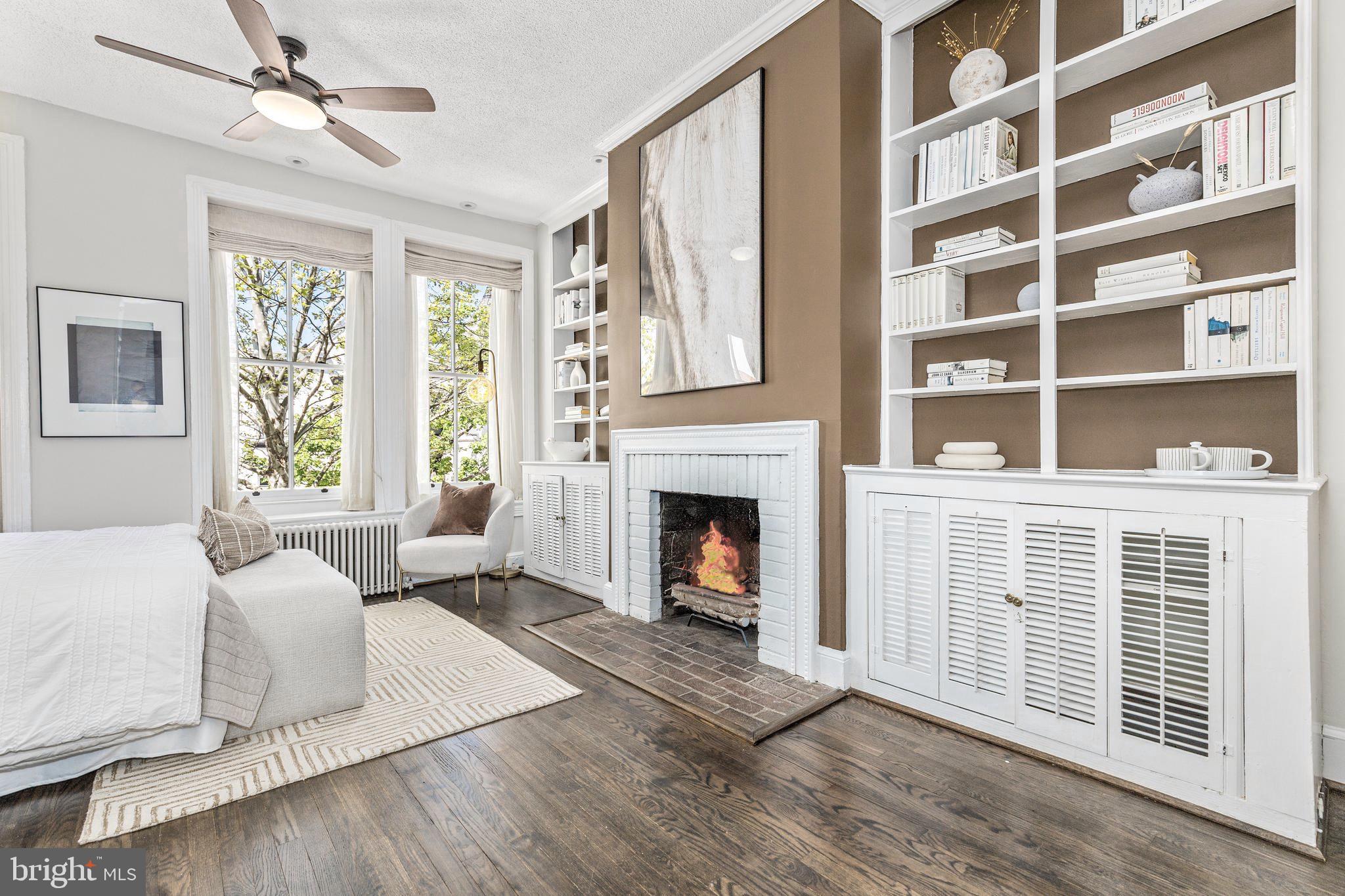 1213 29th Street Northwest Washington, DC 20007 - Photo 13 of 31 a living room with furniture and a fireplace
