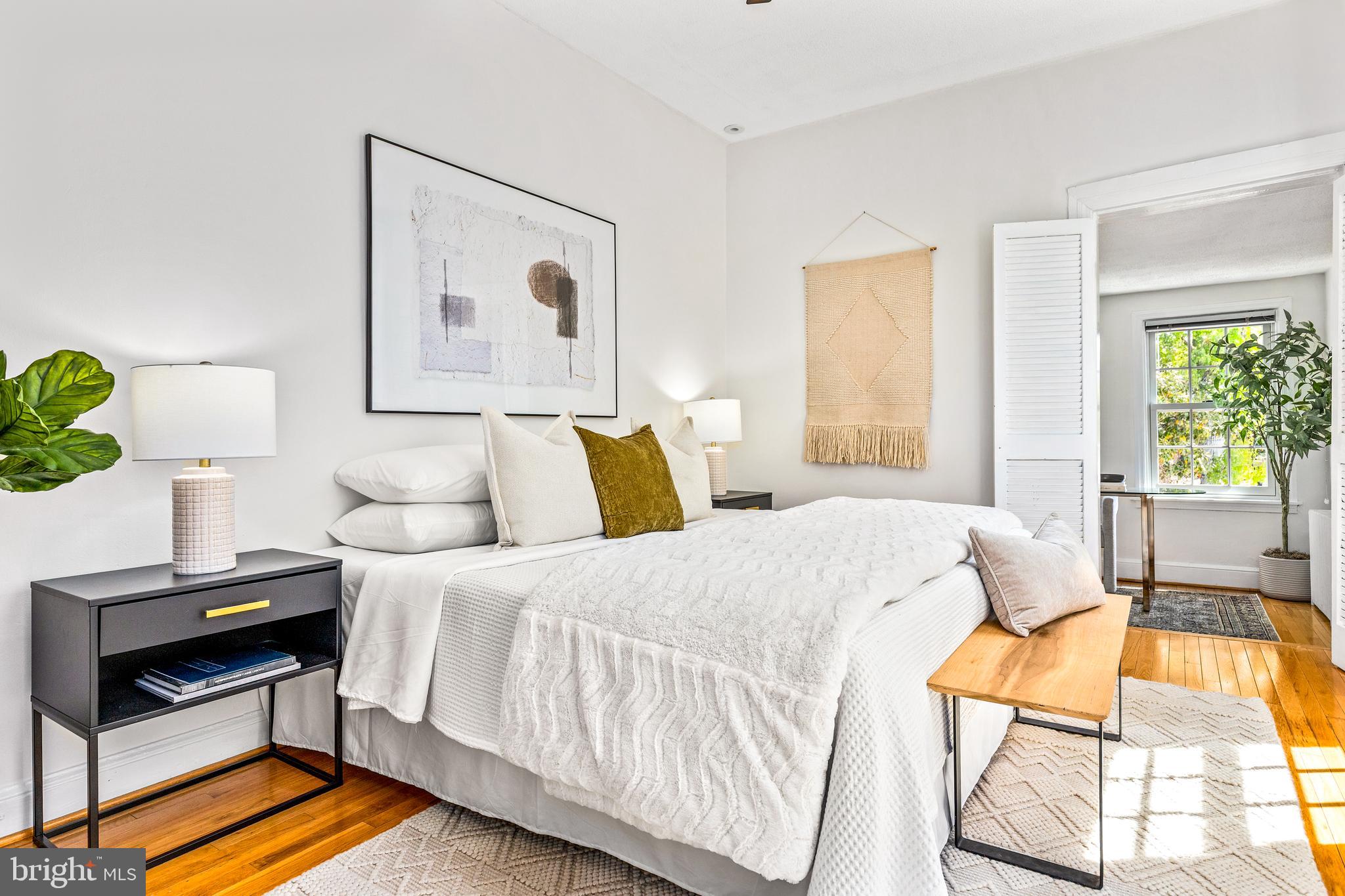 1213 29th Street Northwest Washington, DC 20007 - Photo 16 of 31 a bedroom with a bed and a window