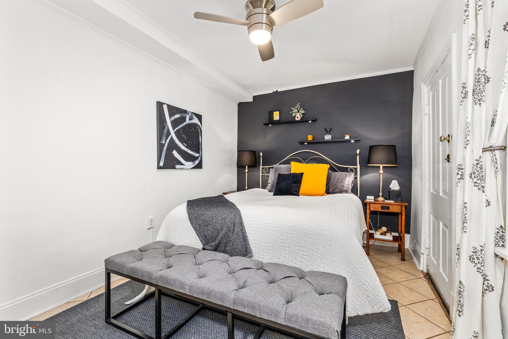 1213 29th Street Northwest Washington, DC 20007 - Photo 25 of 31 a bedroom with a bed and dresser