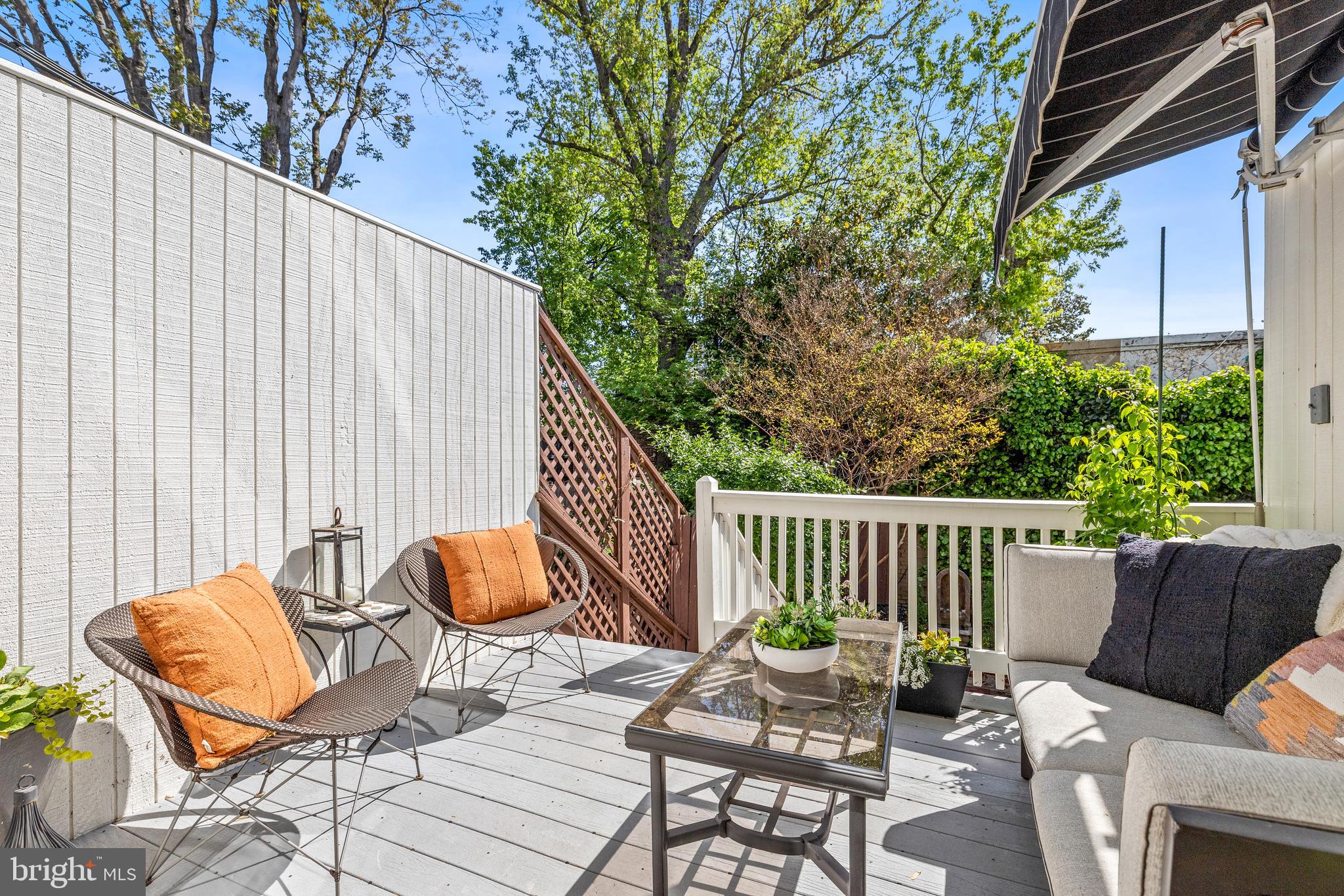 1213 29th Street Northwest Washington, DC 20007 - Photo 28 of 31 a backyard of a house with table and chairs