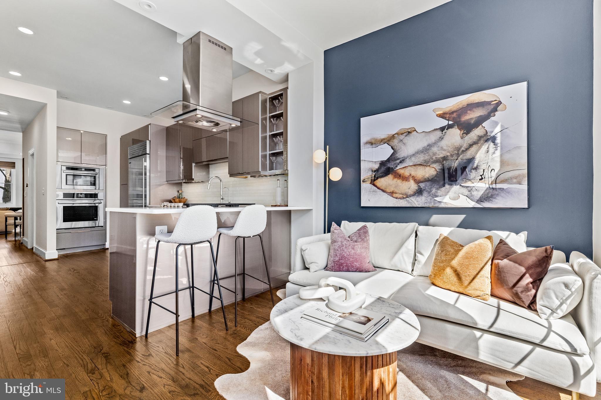 1213 29th Street Northwest Washington, DC 20007 - Photo 8 of 31 a living room with furniture and kitchen view