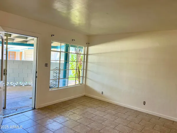 a view of an empty room and window