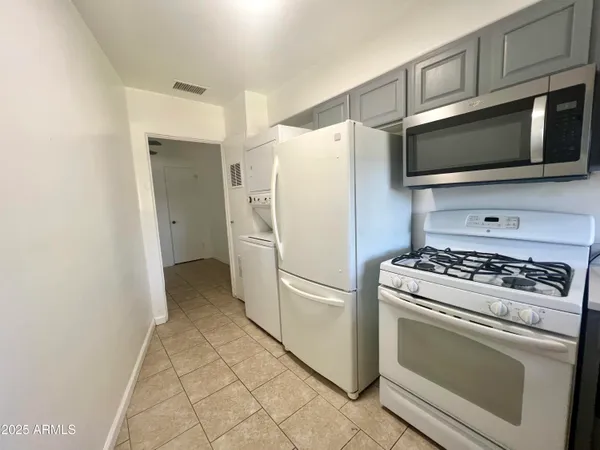 a kitchen with a stove microwave and refrigerator