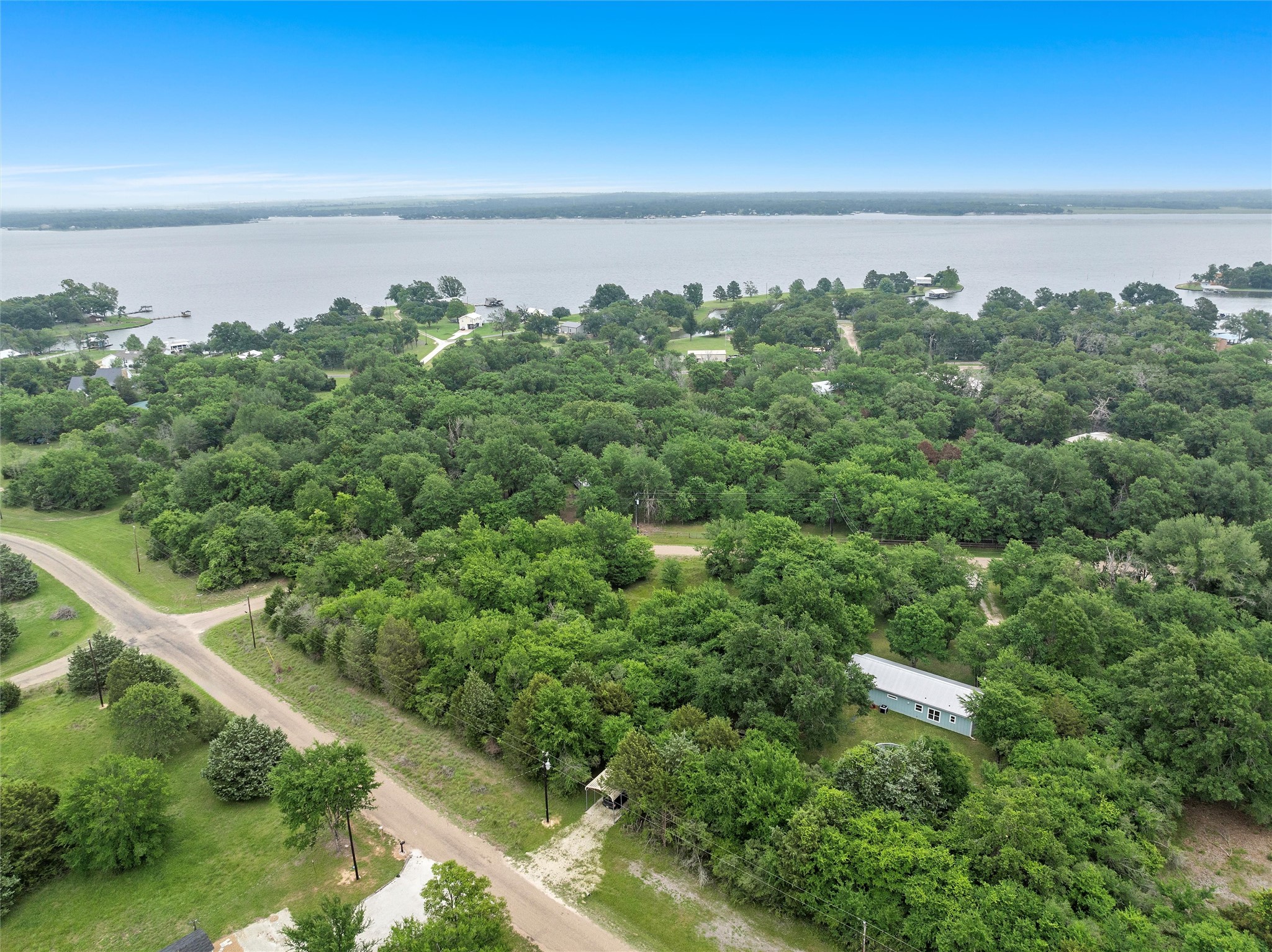 Lot 1 Post Oak Loop Thornton, TX 76687 - Photo 3 of 11 an aerial view of a city with lots of residential buildings and mountain in the back