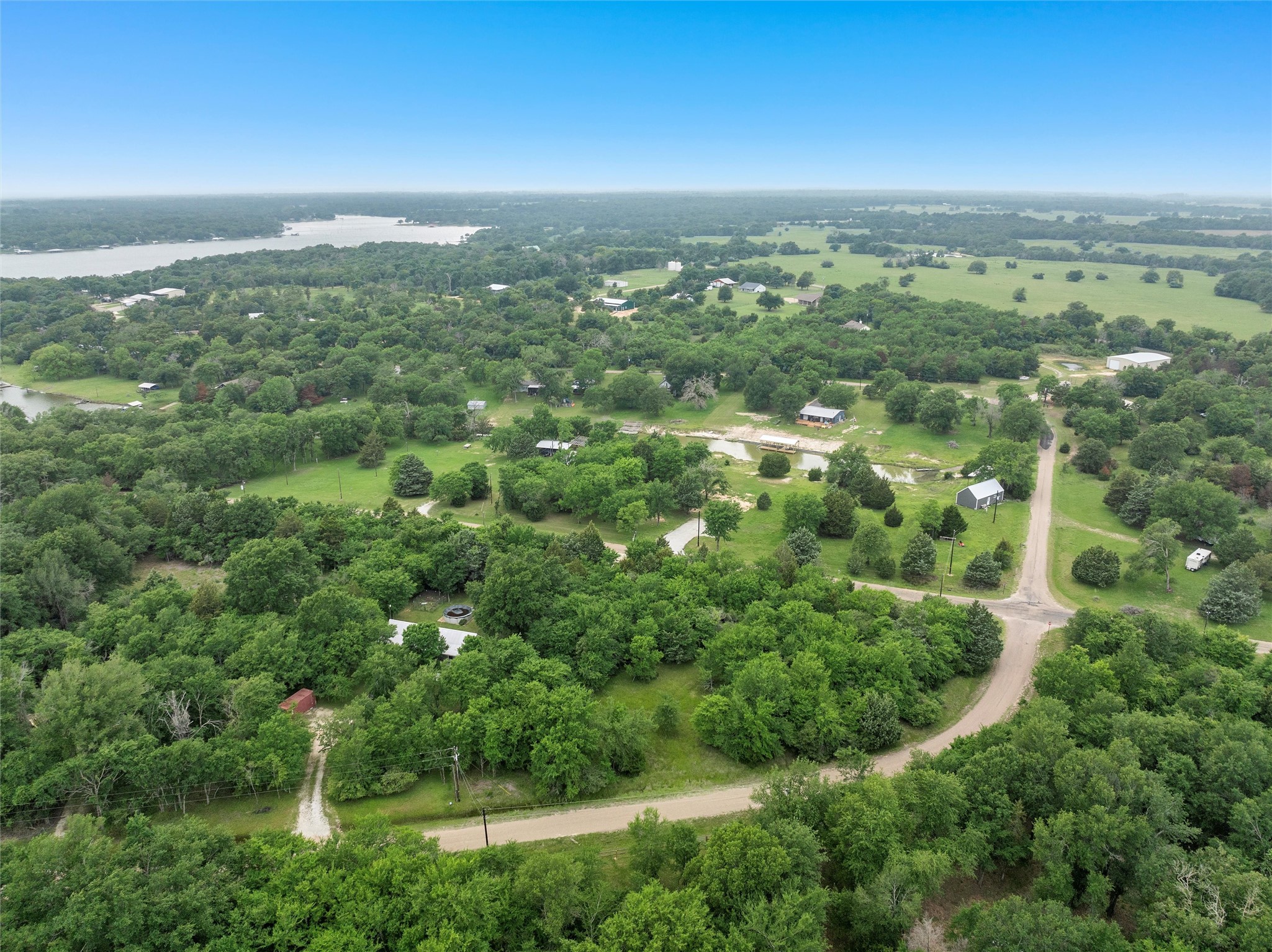 Lot 1 Post Oak Loop Thornton, TX 76687 - Photo 7 of 11 an aerial view of residential houses with outdoor space and trees