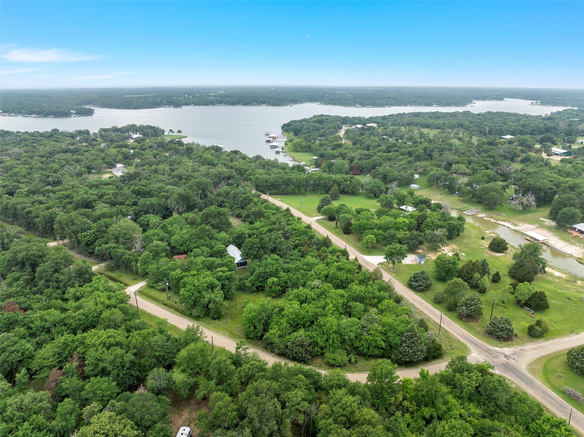 Lot 1 Post Oak Loop Thornton, TX 76687 - Photo 8 of 11 an aerial view of a city with lots of residential buildings and mountain view in back