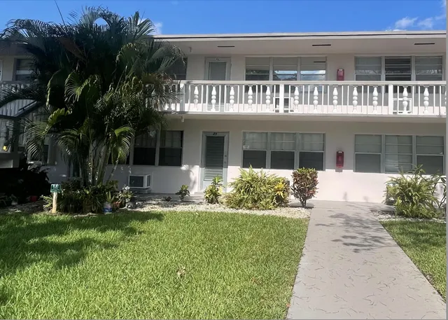 a kitchen with stainless steel appliances granite countertop a sink and a cabinets
