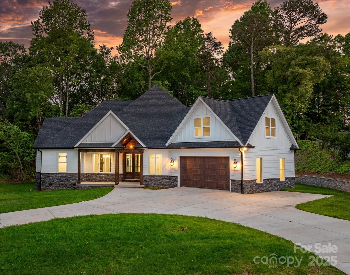 a front view of a house with a yard and porch