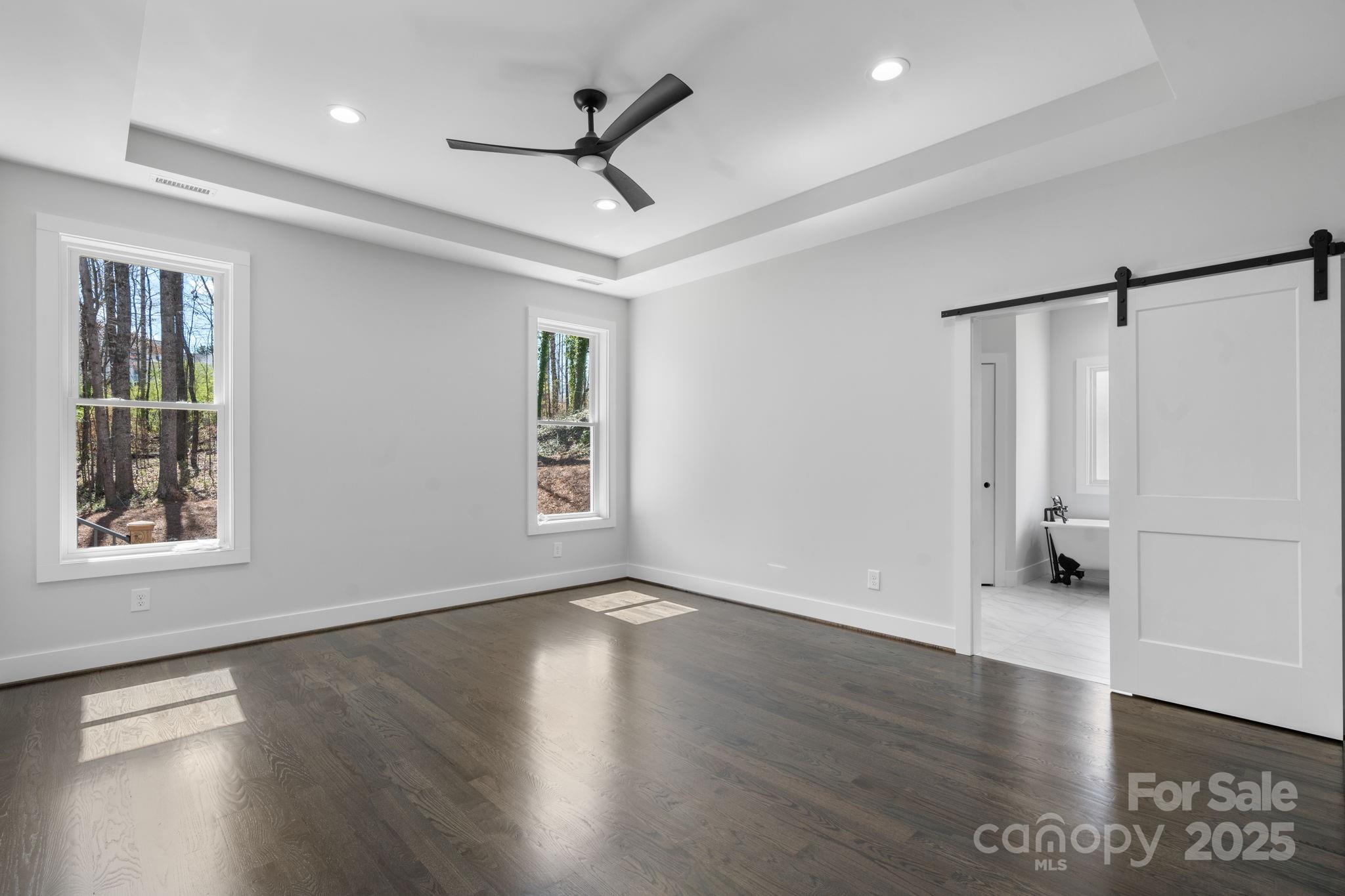 3732 Whitney Drive Northeast Hickory, NC 28601 - Photo 25 of 48 a view of an empty room with wooden floor and a window
