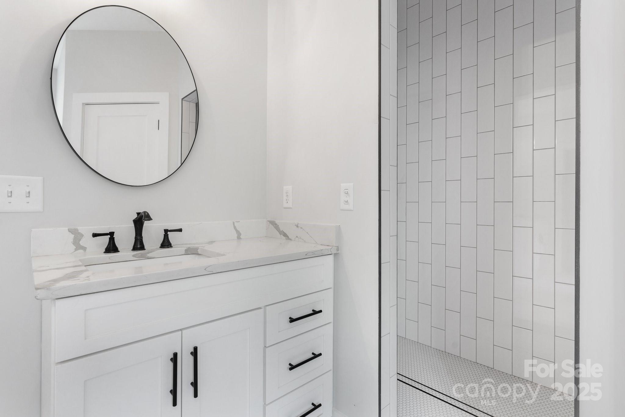 3732 Whitney Drive Northeast Hickory, NC 28601 - Photo 28 of 48 a bathroom with a sink and a mirror