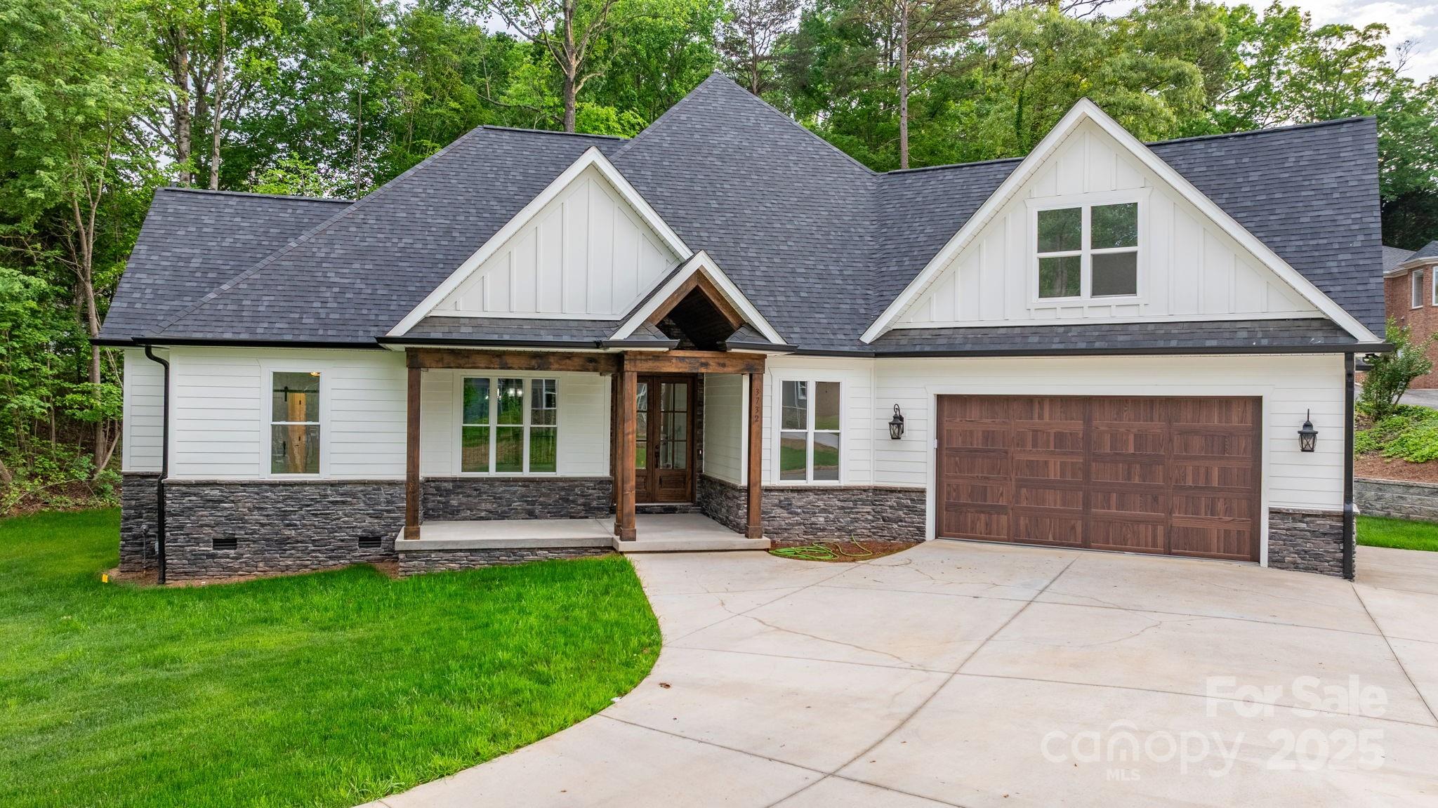 3732 Whitney Drive Northeast Hickory, NC 28601 - Photo 4 of 48 a front view of a house with a garden and yard