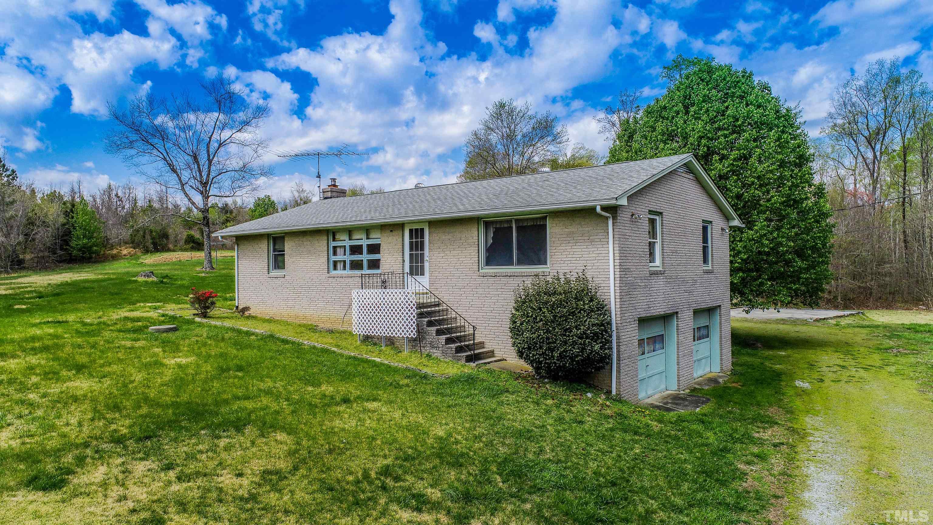 9639 Boston Road Roxboro, NC 27574 - Photo 1 of 52 a view of a house with backyard and garden