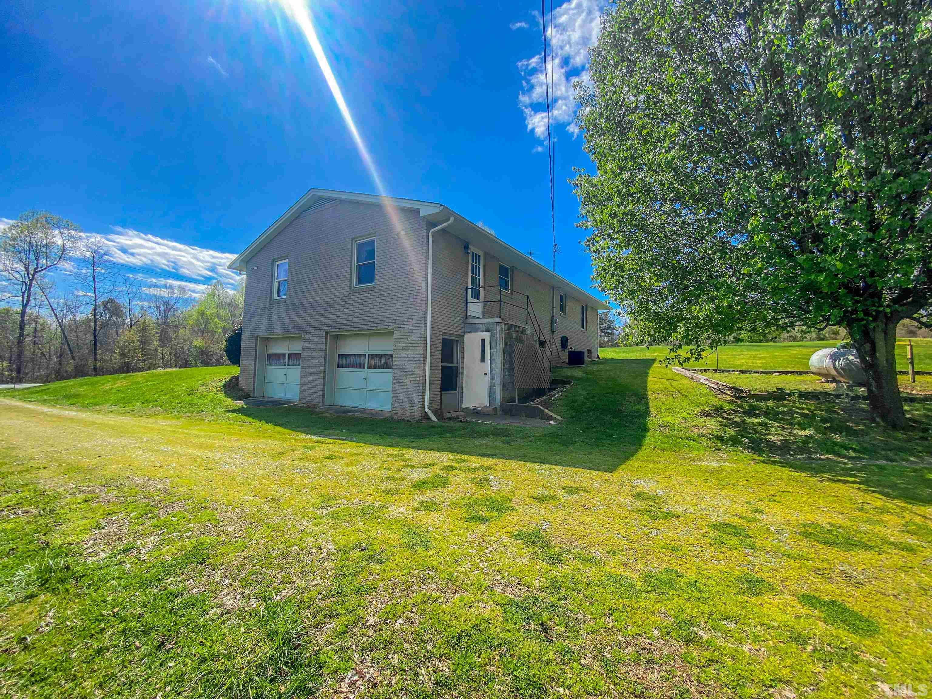 9639 Boston Road Roxboro, NC 27574 - Photo 11 of 52 a view of a house with a yard
