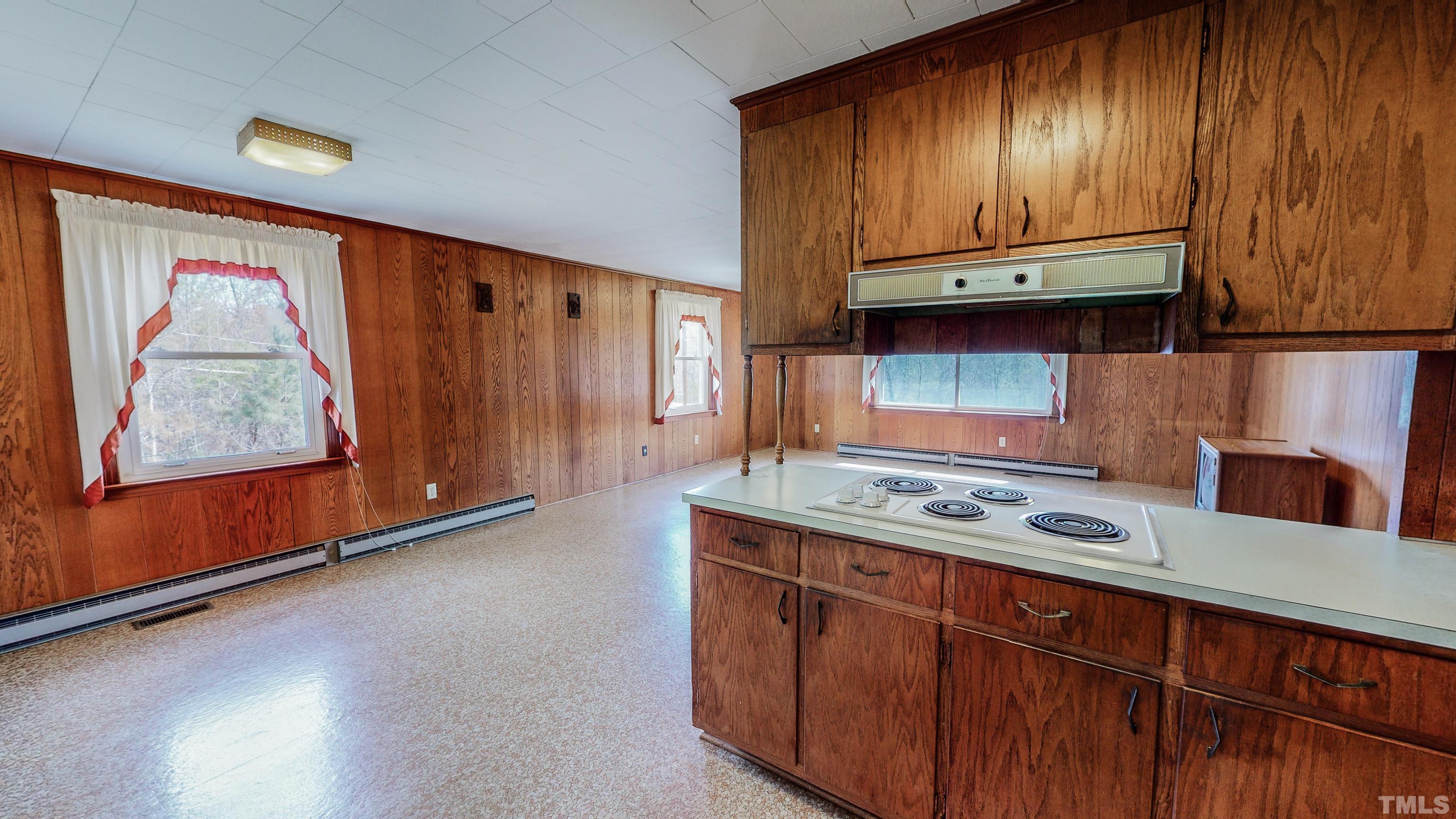 9639 Boston Road Roxboro, NC 27574 - Photo 14 of 52 a kitchen with stainless steel appliances granite countertop wooden cabinets a sink and a stove