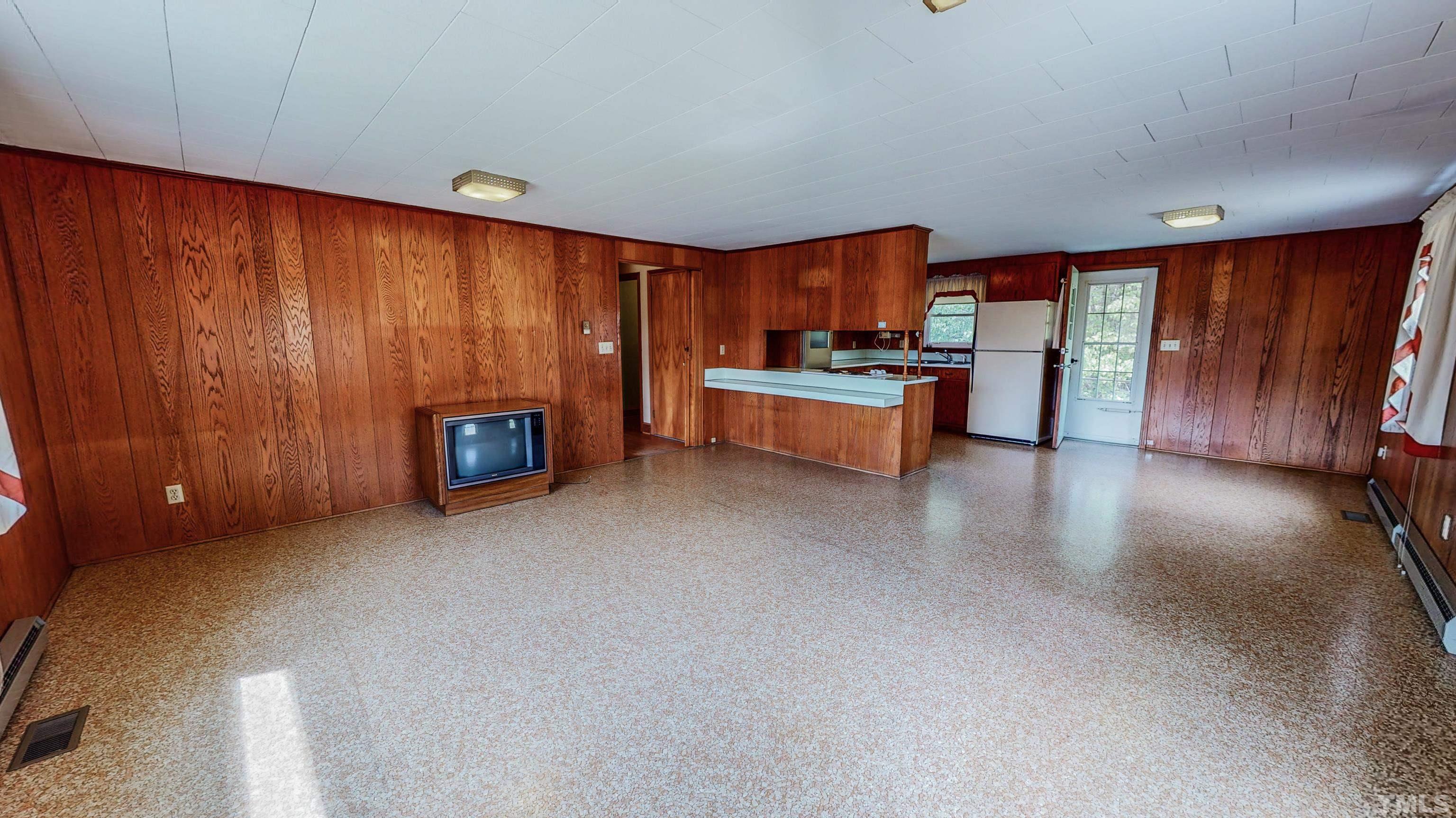9639 Boston Road Roxboro, NC 27574 - Photo 17 of 52 a living room with furniture and a large window