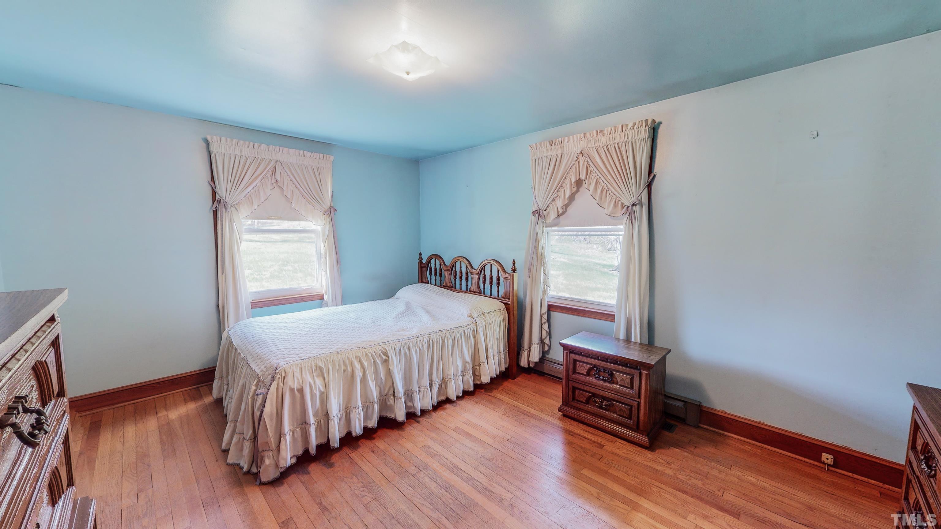 9639 Boston Road Roxboro, NC 27574 - Photo 20 of 52 a bedroom with a bed and a window