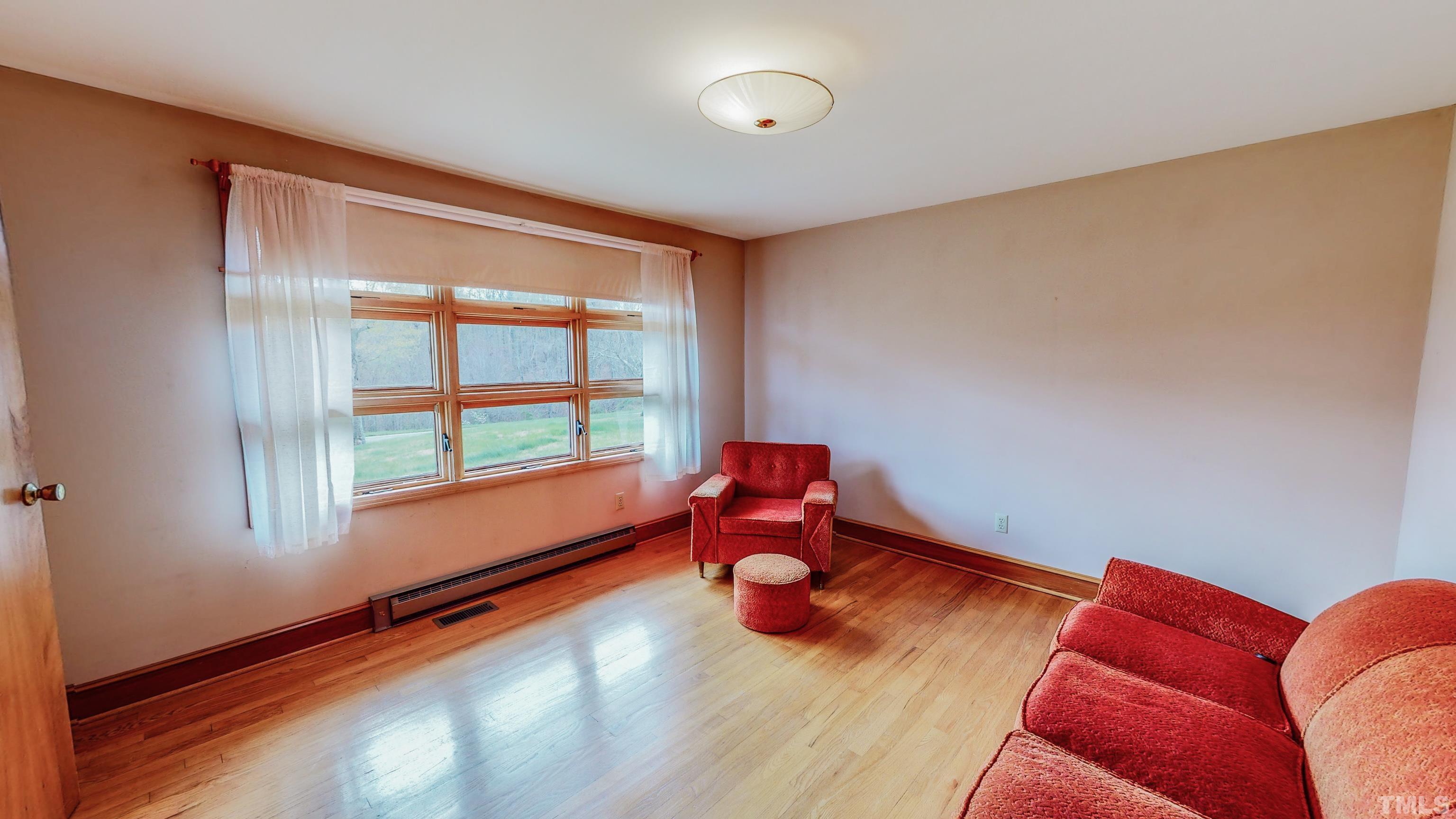 9639 Boston Road Roxboro, NC 27574 - Photo 2 of 52 a room with furniture and a window