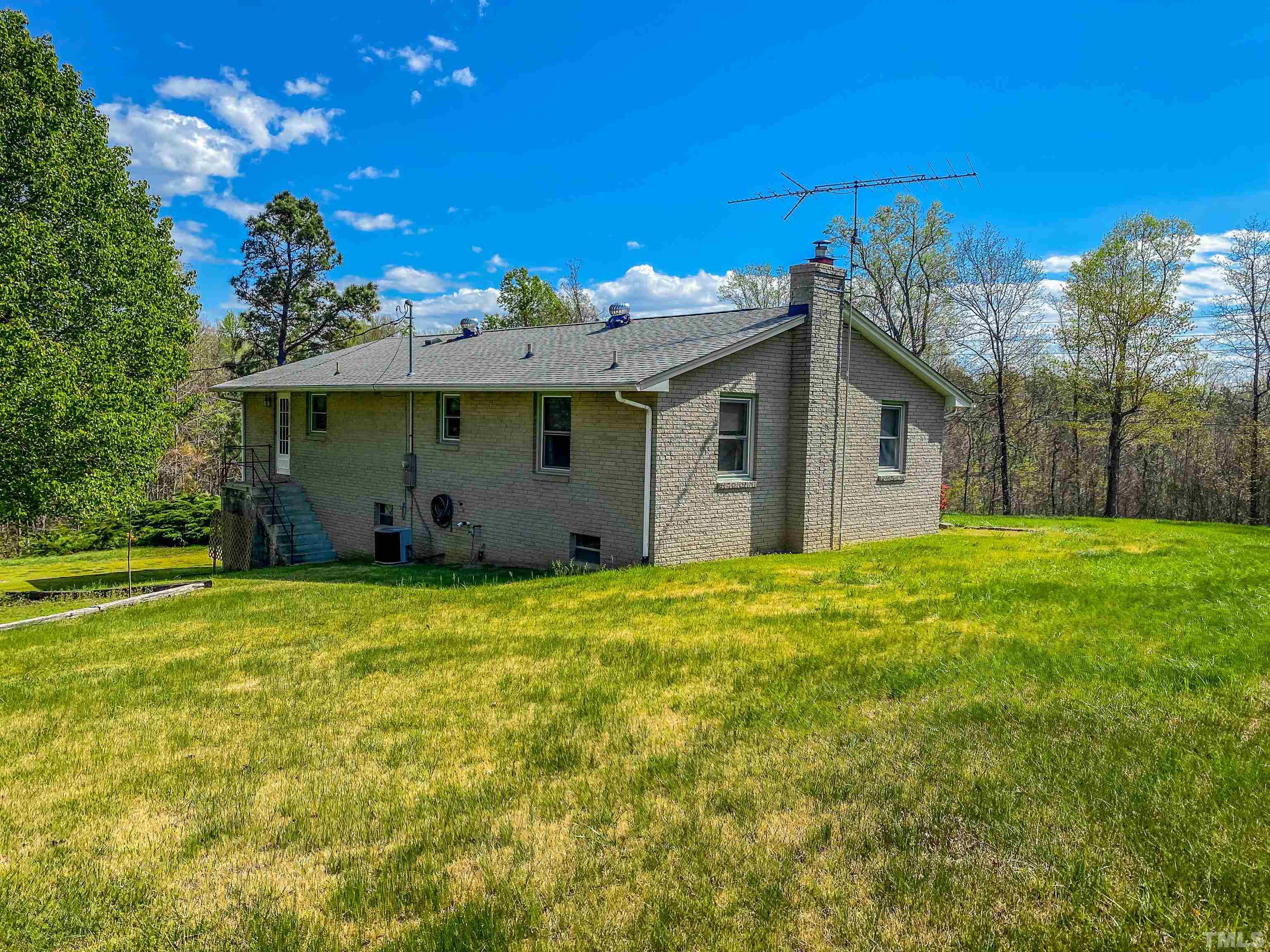 9639 Boston Road Roxboro, NC 27574 - Photo 29 of 52 a view of a house with backyard and garden