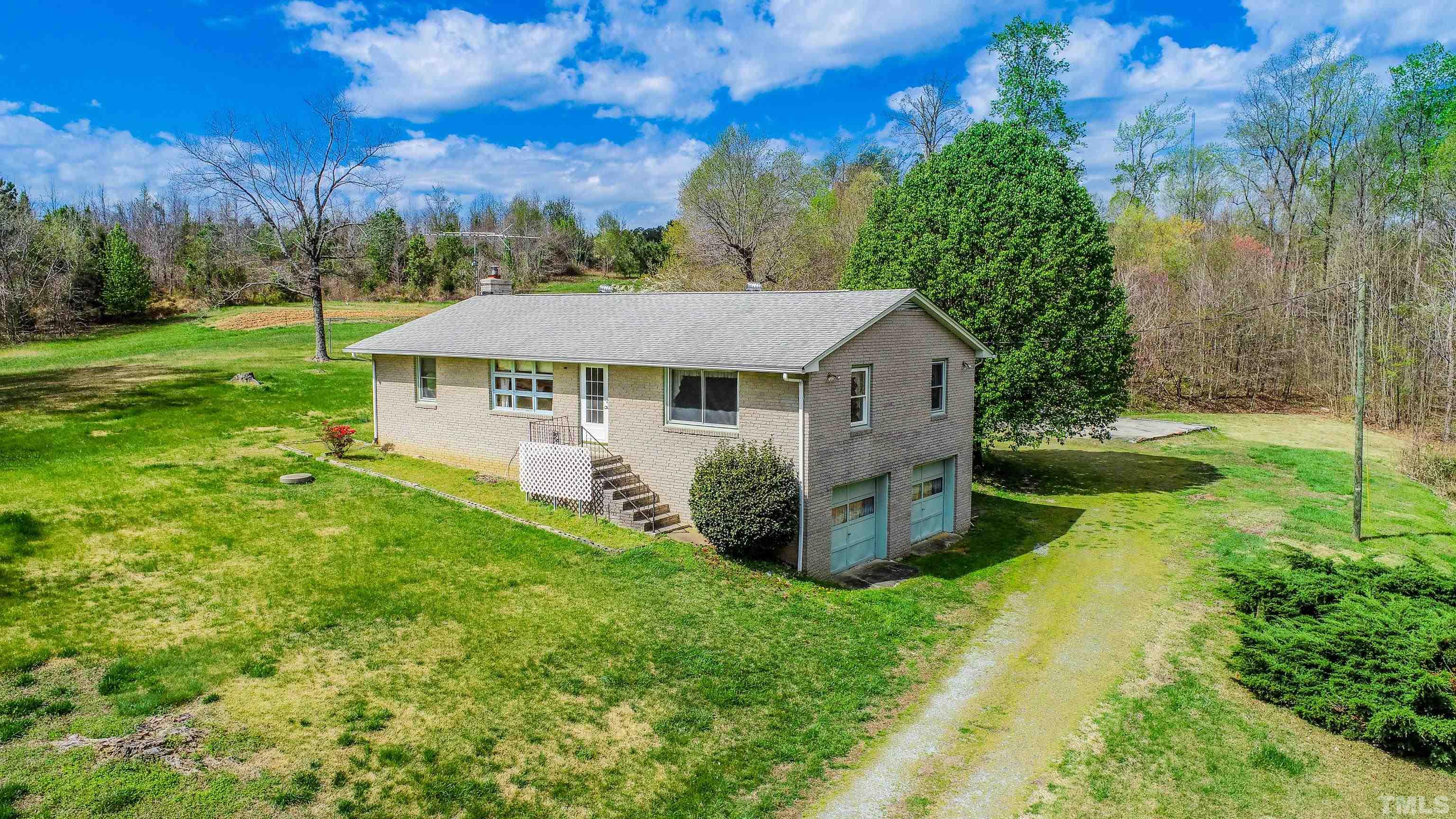 9639 Boston Road Roxboro, NC 27574 - Photo 30 of 52 a view of a house with backyard and garden