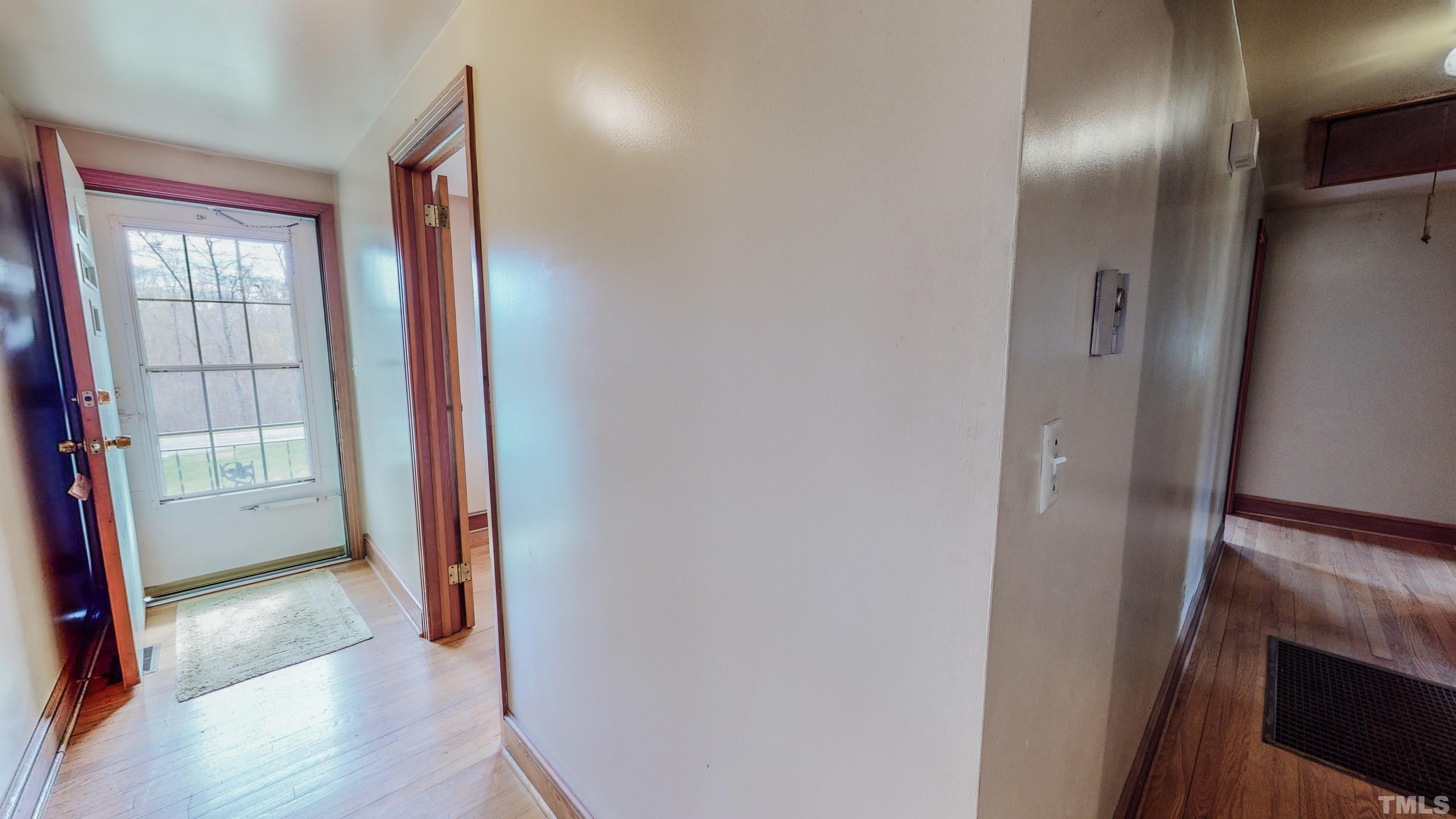 9639 Boston Road Roxboro, NC 27574 - Photo 35 of 52 a view of a hallway with wooden floor and closet