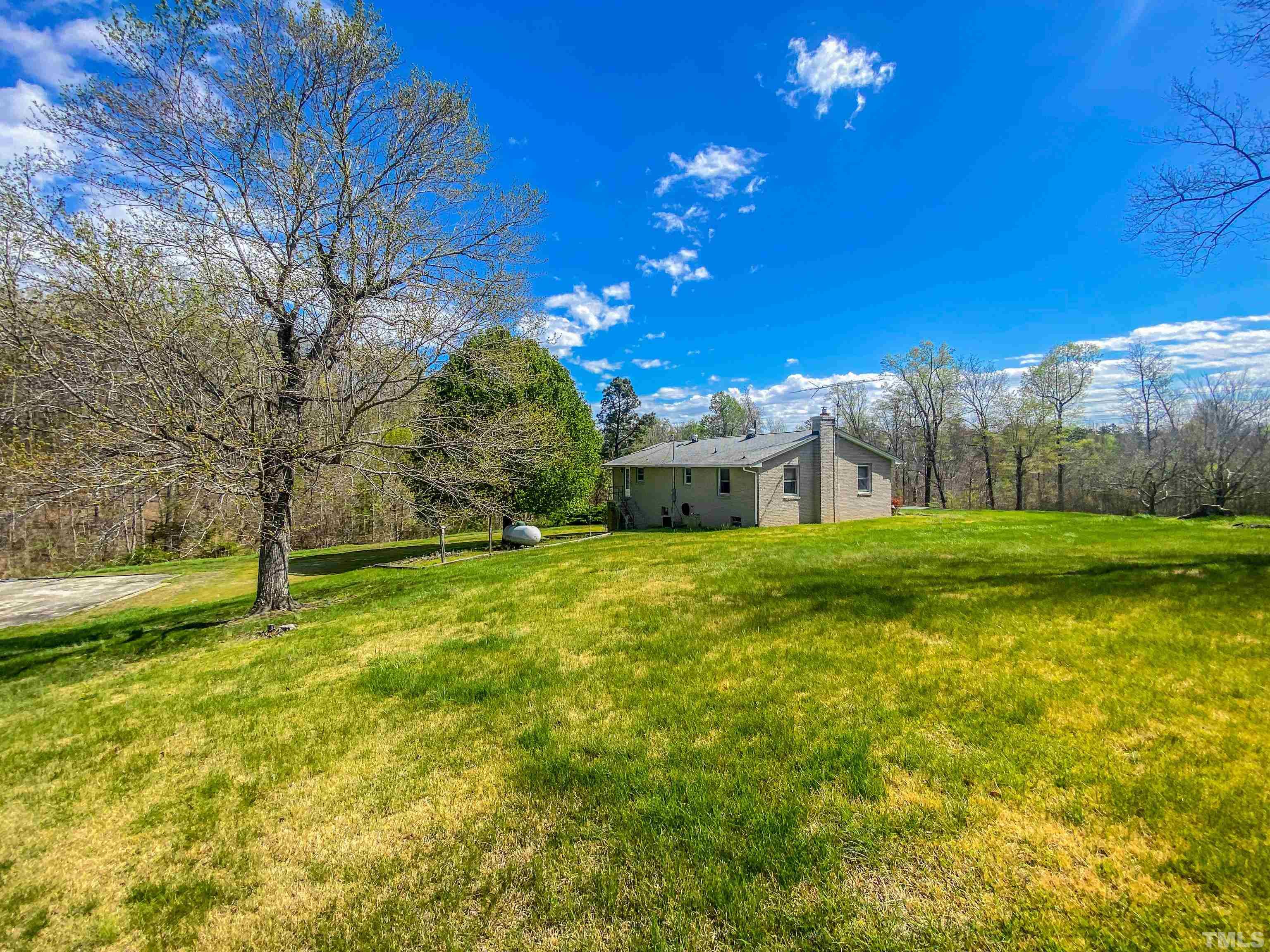 9639 Boston Road Roxboro, NC 27574 - Photo 50 of 52 a view of a house with a yard