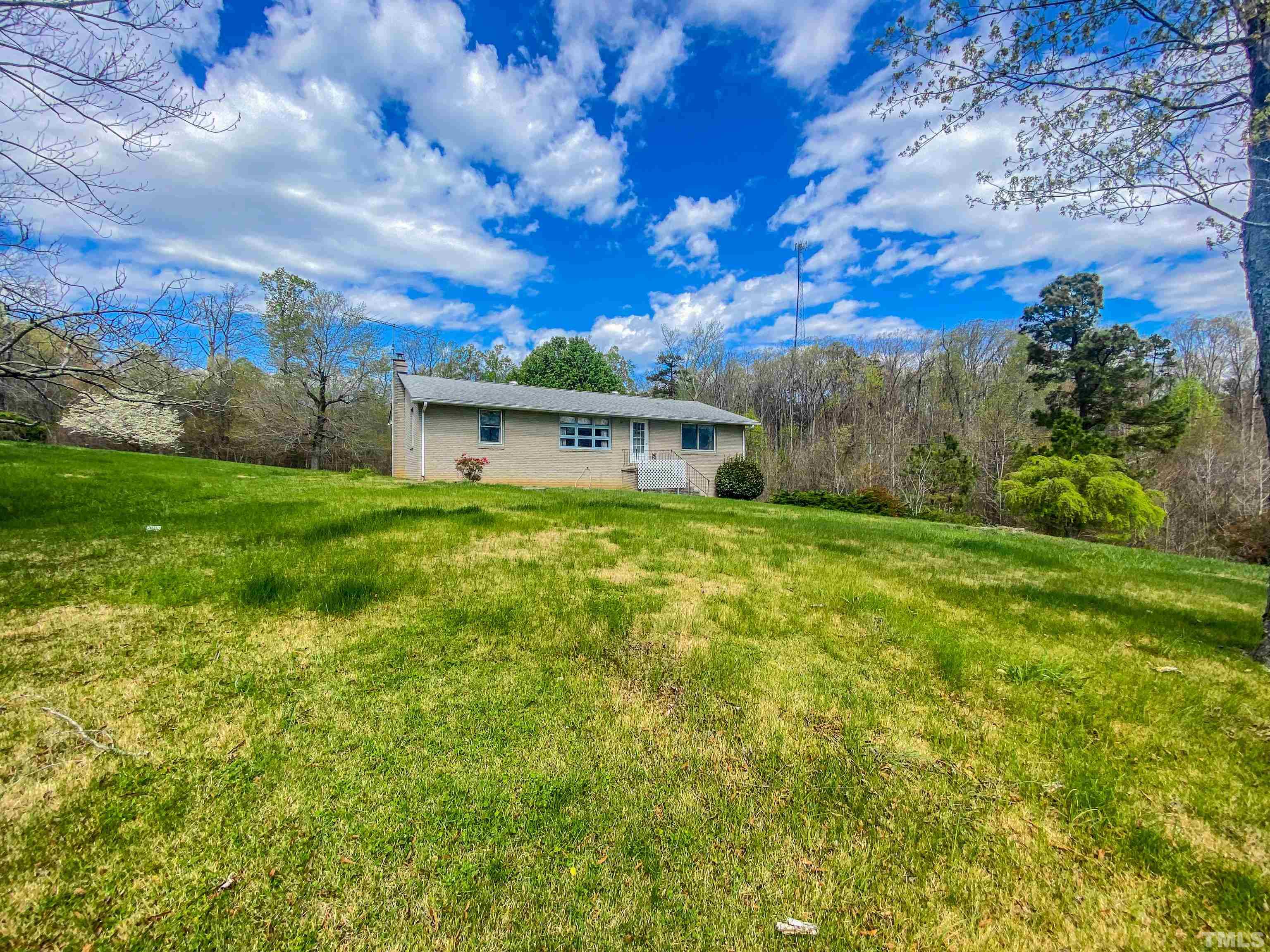 9639 Boston Road Roxboro, NC 27574 - Photo 10 of 52 a view of a house with a big yard