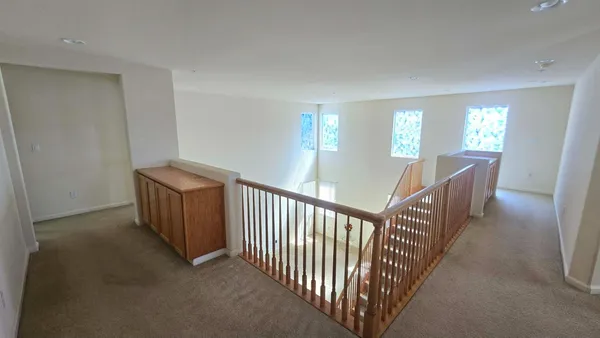 a view of a hallway with windows