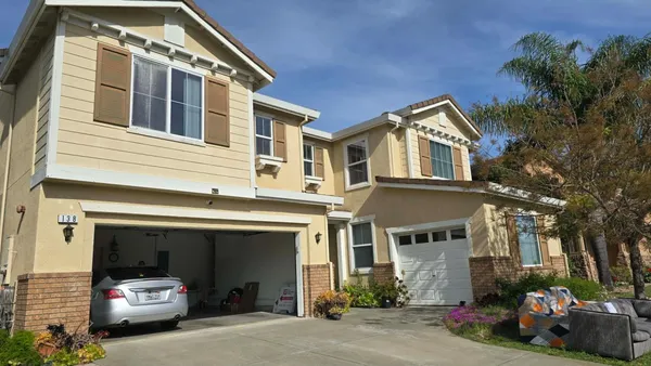 a front view of a house with a garage