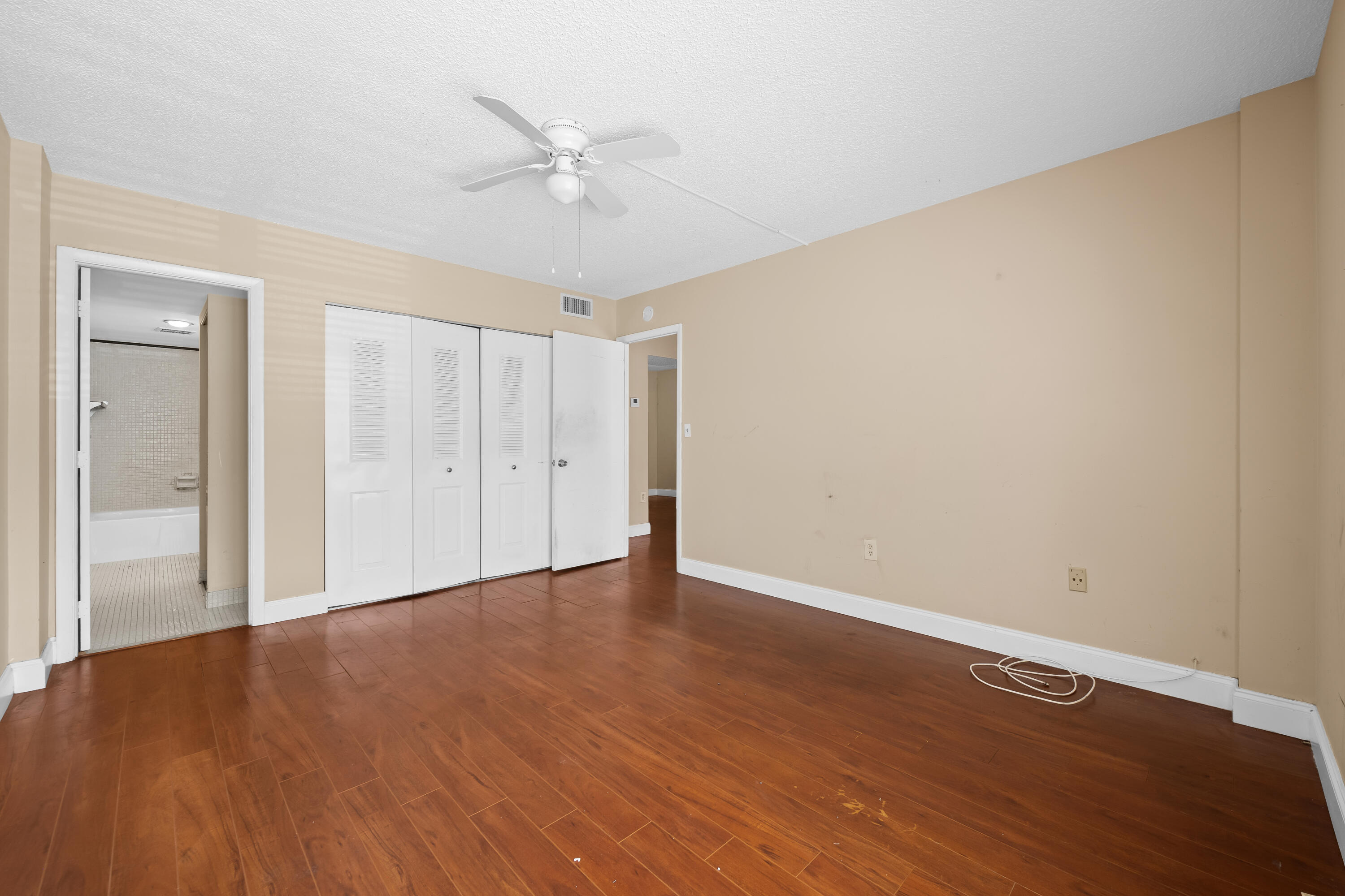 4156 Inverrary Drive, Unit 210 Lauderhill, FL 33319 - Photo 12 of 27 a view of an empty room with wooden floor