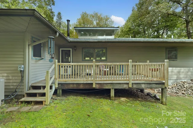 an outdoor view of house with deck having patio
