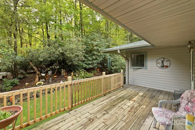 a view of a wooden chairs on the deck