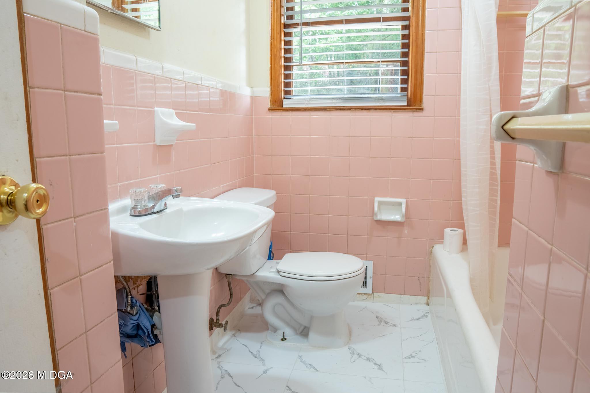 3319 Mohawk Road Macon, GA 31217 - Photo 23 of 38 a bathroom with a sink toilet and a mirror