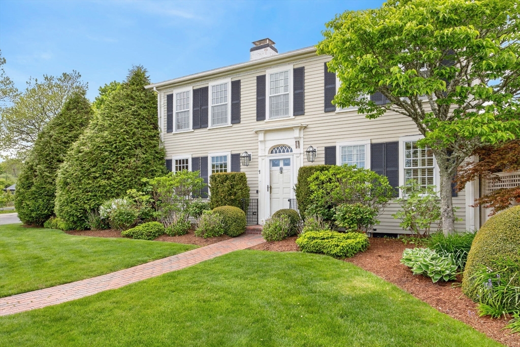 1114 Orleans Road, Unit 1 North Chatham, MA 02650 - Photo 40 of 42 a front view of a house with a garden
