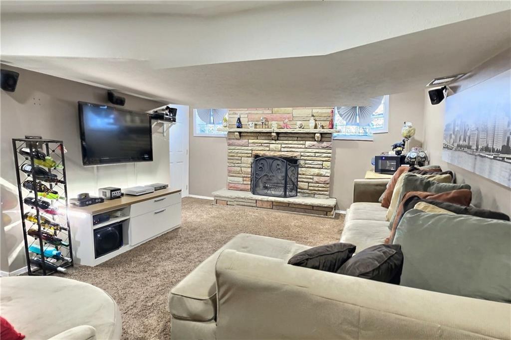717 Morgantown Road Uniontown, PA 15401 - Photo 12 of 18 a living room with furniture and a flat screen tv