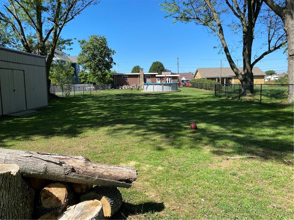 717 Morgantown Road Uniontown, PA 15401 - Photo 17 of 18 a backyard of a house with table and chairs