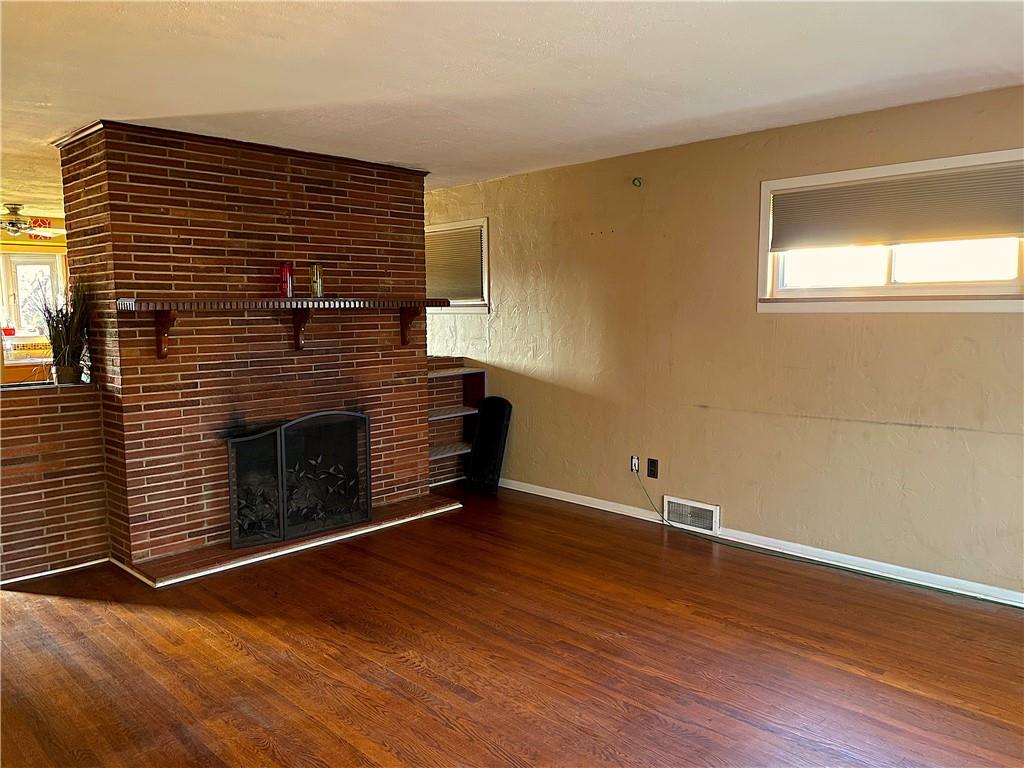 717 Morgantown Road Uniontown, PA 15401 - Photo 4 of 18 a view of an empty room with wooden floor and a window