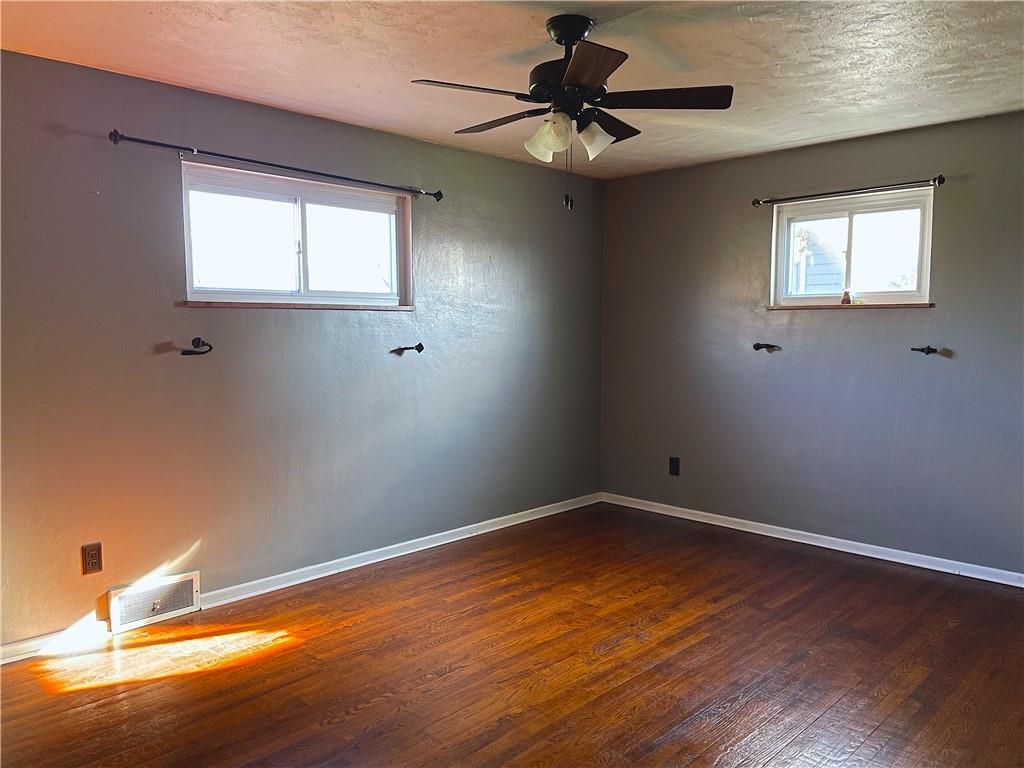 717 Morgantown Road Uniontown, PA 15401 - Photo 10 of 18 a view of a room with wooden floor and chandelier fan