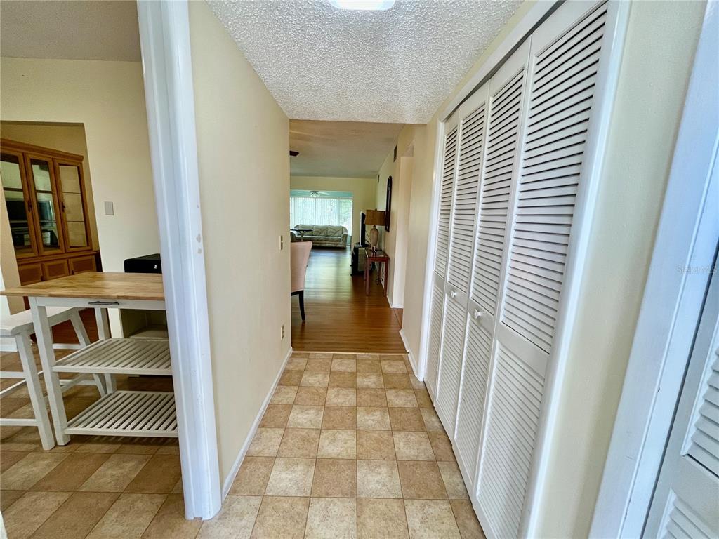 2292 Costa Rican Drive, Unit 22 Clearwater, FL 33763 - Photo 6 of 44 a view of a hallway with a livingroom and furniture