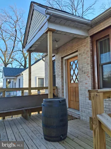 a view of living room and patio with wooden floor
