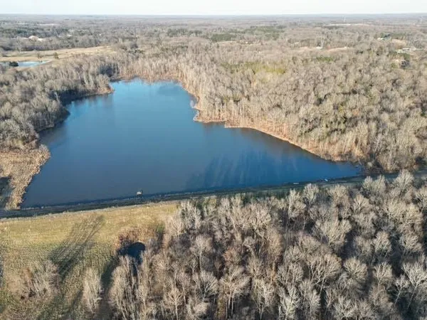 an aerial view of mountain with lake view