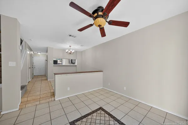 a view of a kitchen with a sink and cabinets