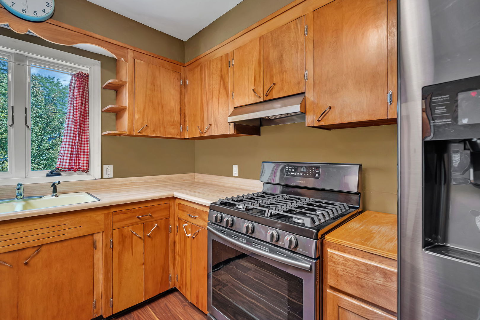 536 Fort Street Ottawa, IL 61350 - Photo 11 of 30 a kitchen with stainless steel appliances granite countertop a sink stove and cabinets