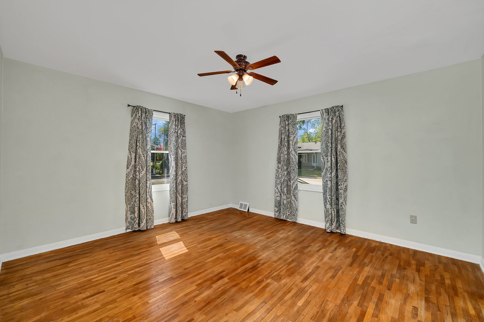 536 Fort Street Ottawa, IL 61350 - Photo 17 of 30 a view of a big room with wooden floor and windows in a room