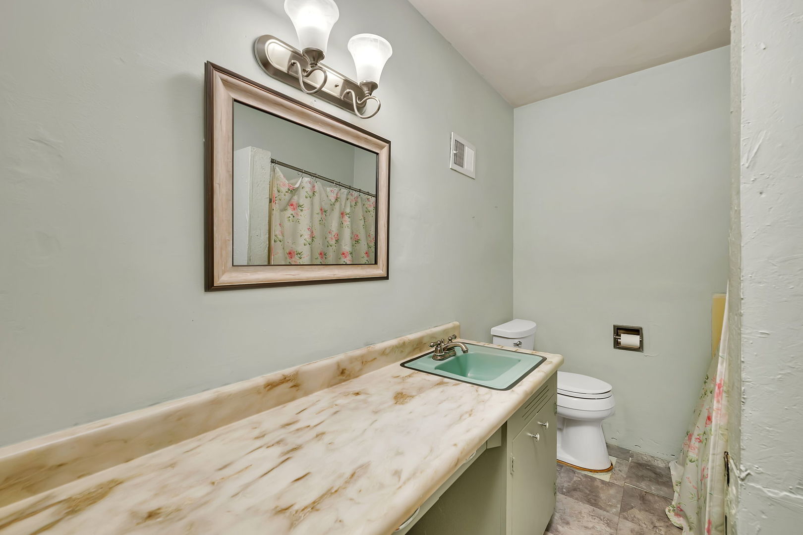 536 Fort Street Ottawa, IL 61350 - Photo 19 of 30 a bathroom with a granite countertop sink a toilet and a mirror