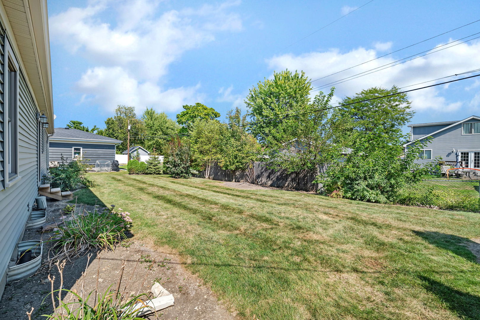 536 Fort Street Ottawa, IL 61350 - Photo 24 of 30 a view of a yard with plants and wooden fence